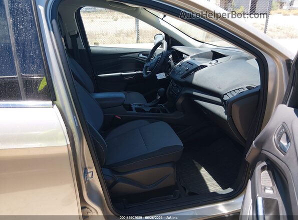 1FMCU0GD0HUC80013 2017 FORD ESCAPE Gold Front interior view