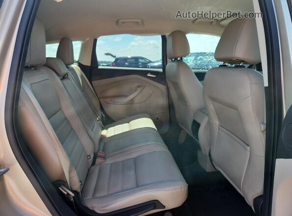 1FMCU0JD0HUE29416 2017 FORD ESCAPE Gold Vista interior trasera