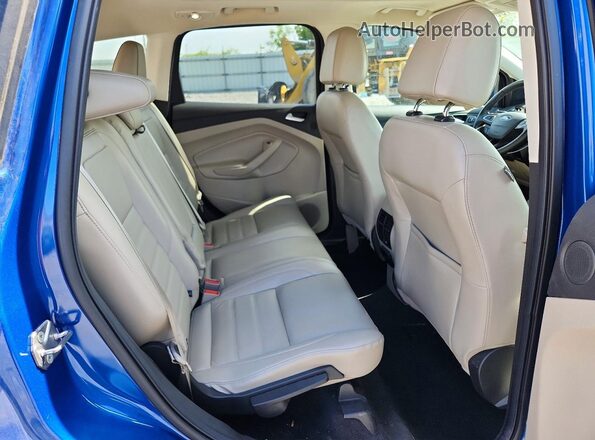 1FMCU9J93HUD74587 2017 FORD ESCAPE Blue Rear seats view