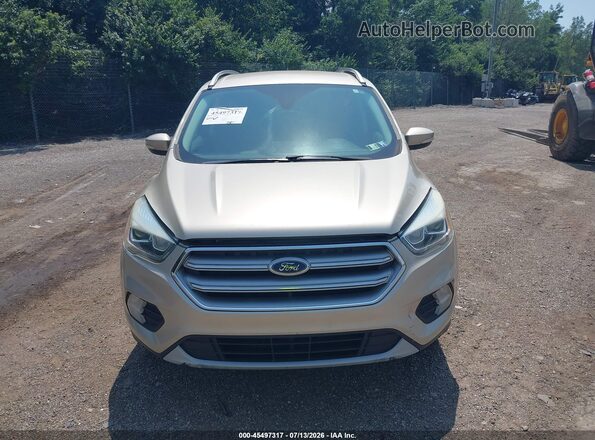 1FMCU9JD5HUE76042 2017 FORD ESCAPE Gold Widok wnętrza z tyłu