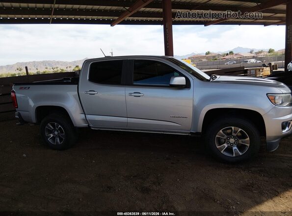 1GCGSDENXH1303295 2017 CHEVROLET COLORADO Silver Սալոնի հետևի տեսք