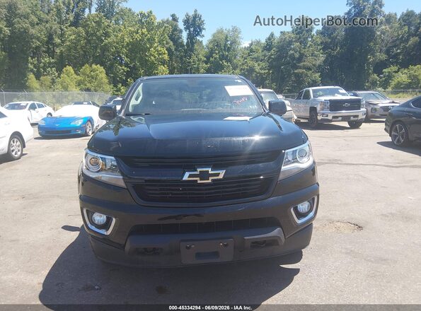 1GCGTDEN7H1180679 2017 CHEVROLET COLORADO Black Widok wnętrza z tyłu