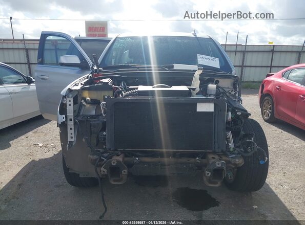 1GNSCBKC7KR409489 2019 CHEVROLET TAHOE Silver უკანა სალონის ხედი