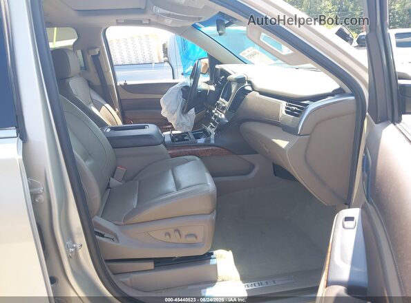 1GNSCCKC0HR296533 2017 CHEVROLET TAHOE Золотой Вид салона спереди