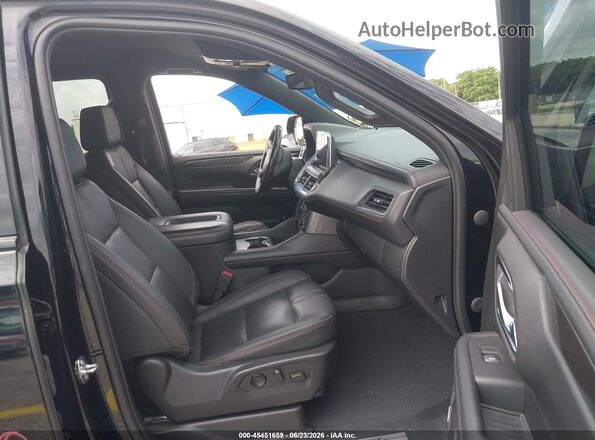 1GNSCEKD8PR116055 2023 CHEVROLET SUBURBAN Black Front interior view