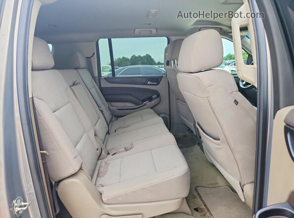 1GNSCGKC7HR370795 2017 CHEVROLET SUBURBAN Tan Widok wnętrza z tyłu