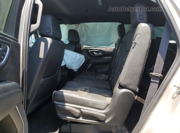 1GNSCNKD4PR395262 2023 CHEVROLET TAHOE Beige Rear interior view