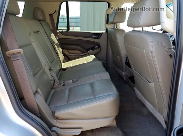 1GNSKBKCXKR177280 2019 CHEVROLET TAHOE Silver უკანა სალონის ხედი