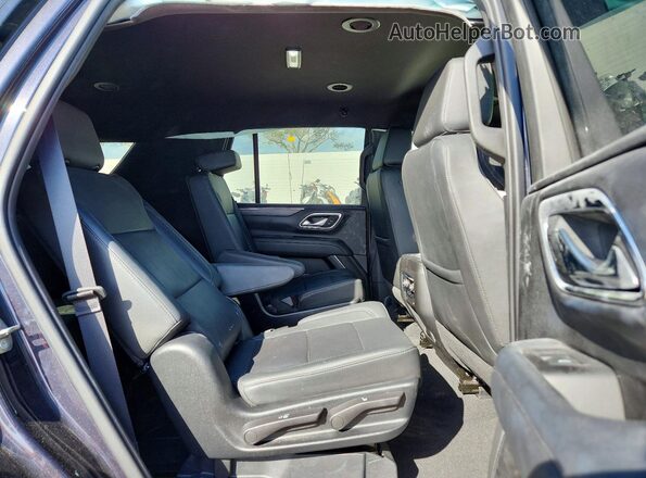 1GNSKPKD6PR228299 2023 CHEVROLET TAHOE Черный Вид задней части салона