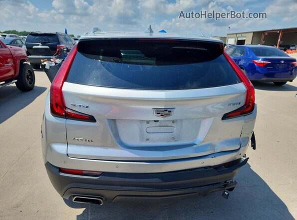 1GYAZAR45MF036804 2021 CADILLAC XT4 Silver Вид ззаду