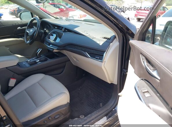 1GYFZDR40MF082080 2021 CADILLAC XT4 Black Front interior view