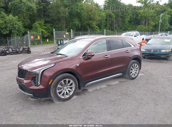 1GYFZDR42PF101085 2023 CADILLAC XT4 Burgundy წინა მარცხენა ხედი სამი მეოთხედიდან