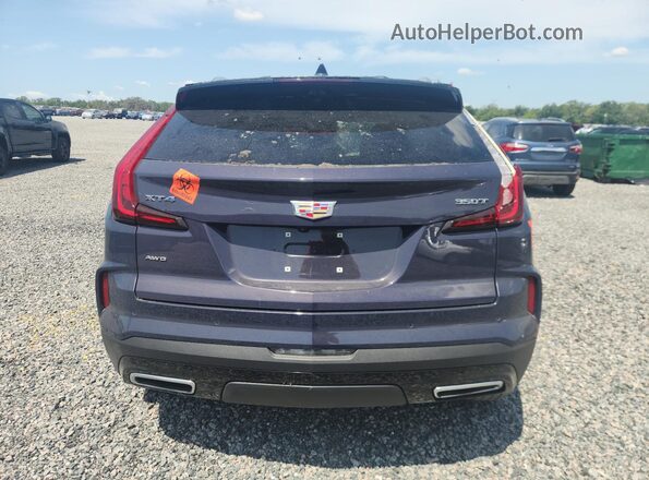 1GYFZDR45RF198026 2024 CADILLAC XT4 Синий Вид сзади