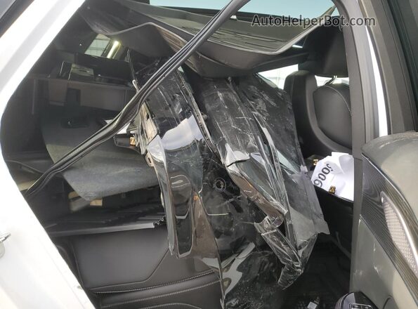 1GYKPRRK2RZ105106 2024 CADILLAC OTHER White Սալոնի հետևի տեսք