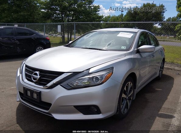 1N4AL3AP2GC157763 2016 NISSAN ALTIMA Silver Vista tres cuartos delantera izquierda