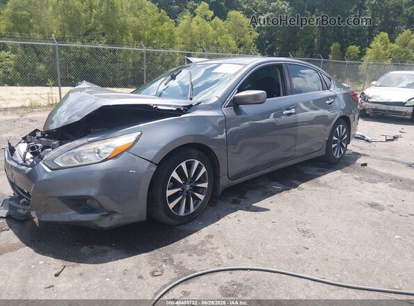 1N4AL3AP6GC274455 2016 NISSAN ALTIMA Silver Vista tres cuartos delantera izquierda
