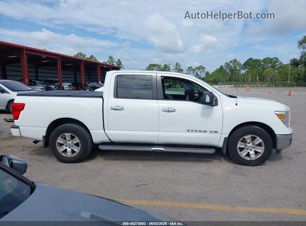 1N6AA1E63KN511371 2019 NISSAN TITAN White Rear interior view