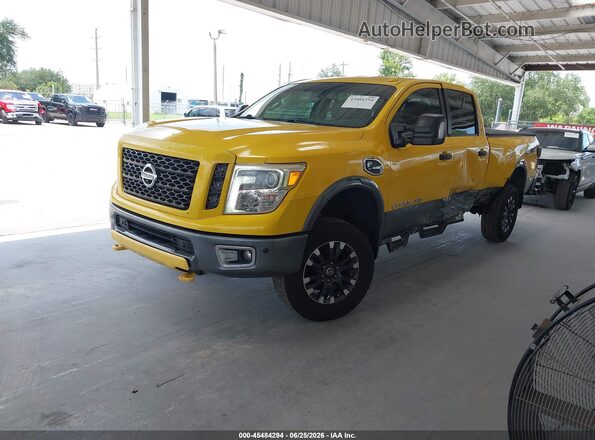 1N6BA1F44HN558001 2017 NISSAN TITAN XD Yellow Առջևի ձախ երեք քառորդ տեսարան