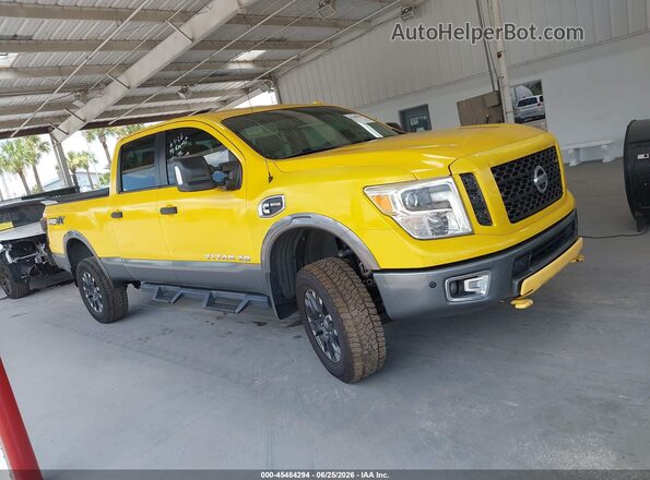 1N6BA1F44HN558001 2017 NISSAN TITAN XD Yellow Սալոնի հետևի տեսք