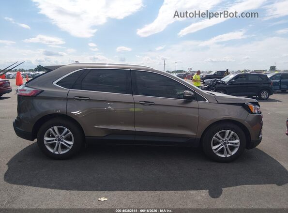2FMPK4J92KBB00255 2019 FORD EDGE Brown Vista interior trasera