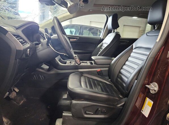 2FMPK4J93RBB09850 2024 FORD EDGE Maroon Widok wnętrza z przodu