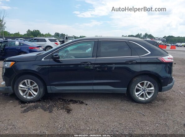 2FMPK4J99KBB23483 2019 FORD EDGE Black Вид задньої частини салону