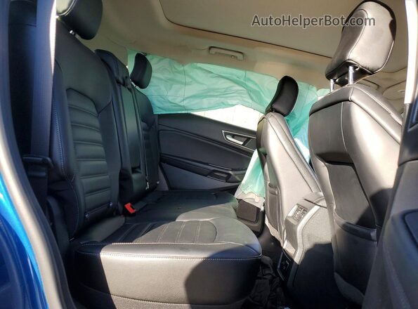 2FMPK4J99RBA64154 2024 FORD EDGE Blue Widok wnętrza z tyłu