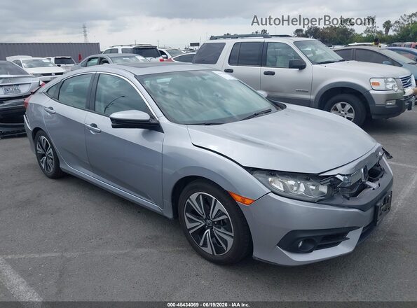 2HGFC1F32HH633648 2017 HONDA CIVIC Серебряный Вид задней части салона
