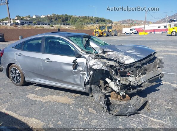 2HGFC1F46HH652938 2017 HONDA CIVIC Серебряный Вид задней части салона