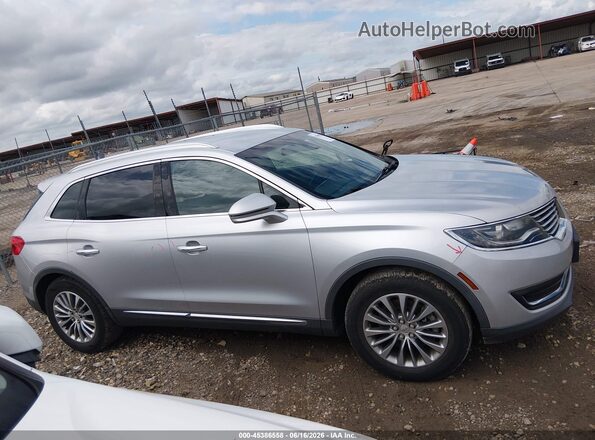 2LMPJ6KR4HBL53104 2017 LINCOLN MKX Silver Widok wnętrza z tyłu