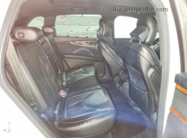2LMTJ8LP1GBL71176 2016 LINCOLN MKX White Rear interior view