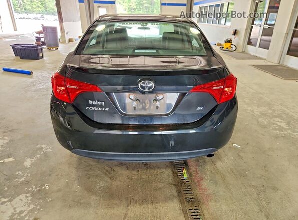 2T1BURHE2HC867161 2017 TOYOTA COROLLA Black Rear view
