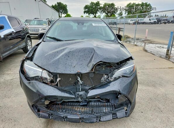 2T1BURHE2JC004687 2018 TOYOTA COROLLA Black Front view