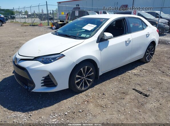 2T1BURHE2JC033106 2018 TOYOTA COROLLA White Vista tres cuartos delantera izquierda