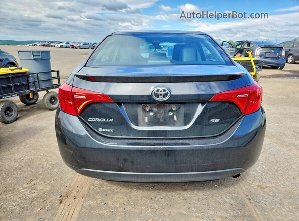 2T1BURHE6JC000805 2018 TOYOTA COROLLA Black Rear view
