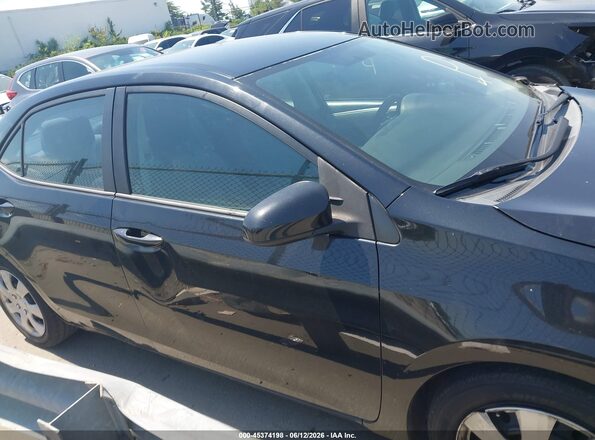 2T1BURHE7GC572801 2016 TOYOTA COROLLA Черный Вид задней части салона