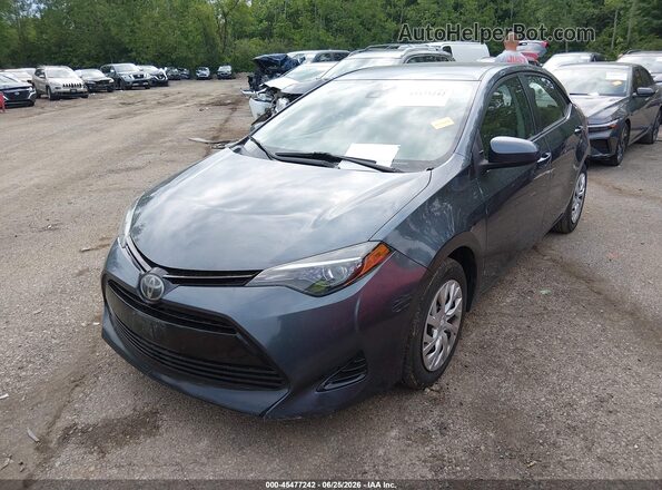2T1BURHE7JC988435 2018 TOYOTA COROLLA Blue Vista tres cuartos delantera izquierda