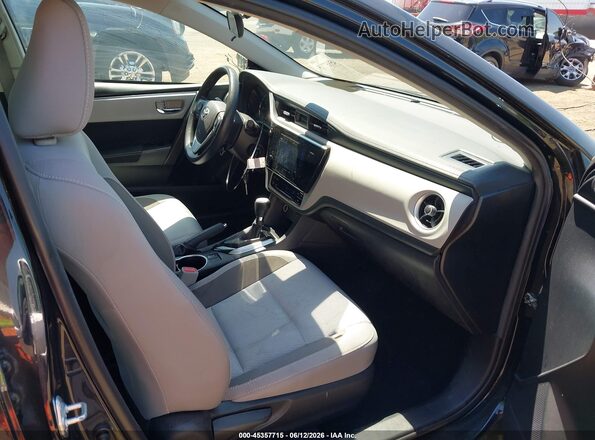 2T1BURHE8HC861686 2017 TOYOTA COROLLA Black Front interior view