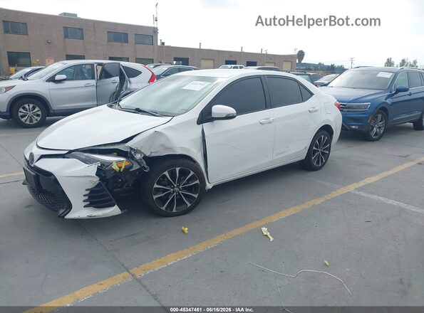 2T1BURHE8KC207097 2019 TOYOTA COROLLA White Front left