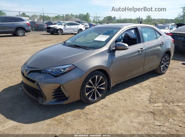 2T1BURHE9JC095229 2018 TOYOTA COROLLA Gray Vista tres cuartos delantera izquierda