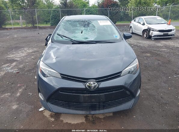 2T1BURHEXHC813378 2017 TOYOTA COROLLA Gray Vista interior trasera
