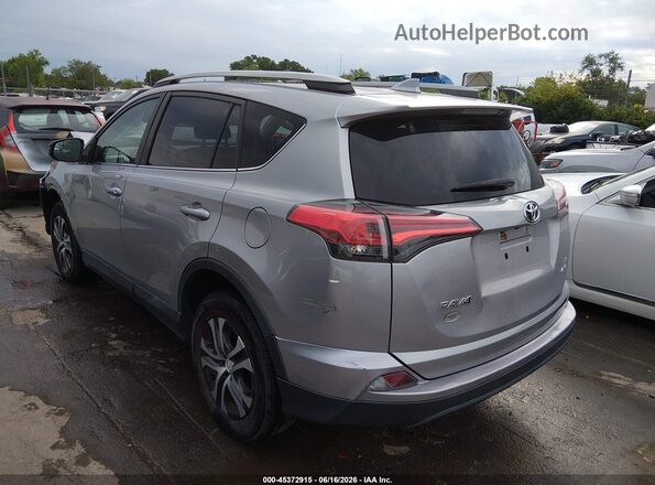 2T3BFREV2JW770312 2018 TOYOTA RAV4 Silver Trasero izquierdo