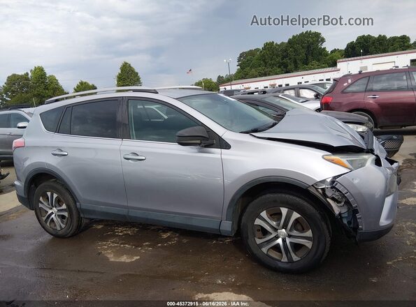 2T3BFREV2JW770312 2018 TOYOTA RAV4 Silver Vista interior trasera