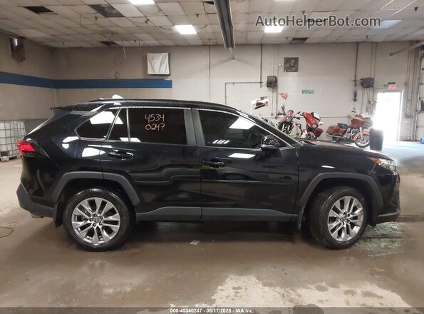 2T3C1RFV3RC278354 2024 TOYOTA RAV4 Black Вид задньої частини салону