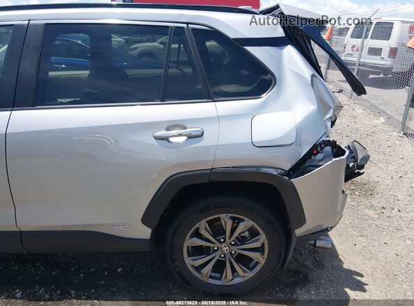 2T3D6RFV9RW079975 2024 TOYOTA RAV4 HYBRID Silver Rear interior view