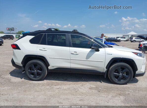2T3E6RFV4MW014528 2021 TOYOTA RAV4 HYBRID White Widok wnętrza z tyłu