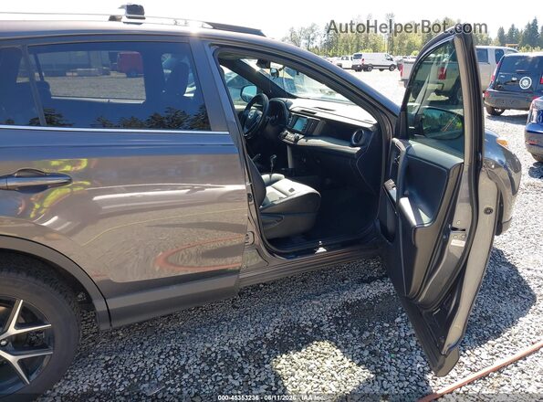 2T3JFREV5GW454312 2016 TOYOTA RAV4 Gray წინა სალონის ხედი