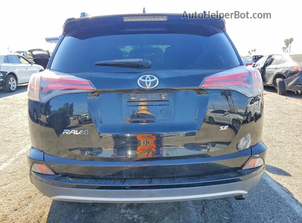 2T3NFREV2GW252240 2016 TOYOTA RAV4 Black Rear view