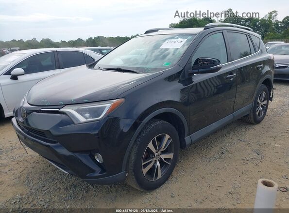 2T3RFREV1JW731869 2018 TOYOTA RAV4 Черный Передняя левая четверть
