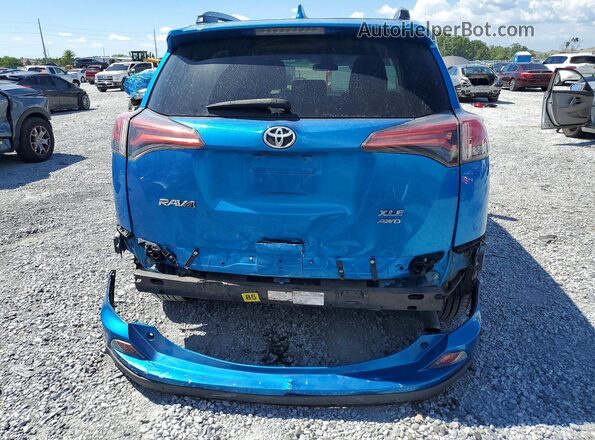 2T3RFREV1JW815111 2018 TOYOTA RAV4 Blue Вид ззаду